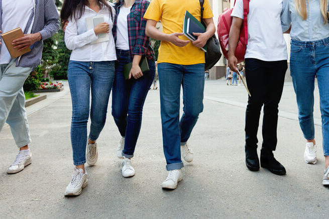 College students in high school campus walking during break