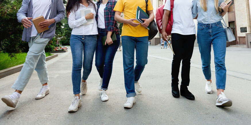 College students in high school campus walking during break