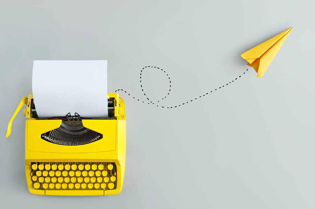 Yellow Typewriter with Airplane