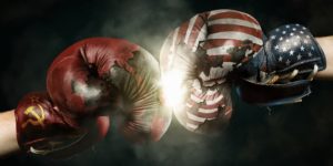A soviet boxing glove clashing with a U.S.A boxing glove.