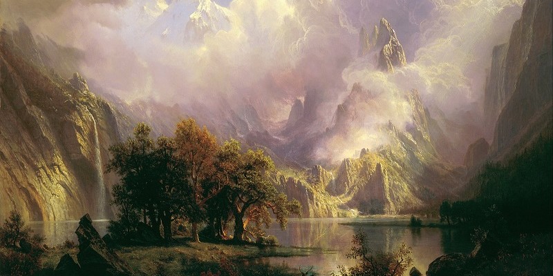 Landscape painting of a lake, trees, and mountains by artist Albert Bierstadt.