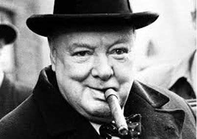 Black and white photo of Winston Churchill. Churchill has a top hat on and a cigar in mouth. Churchill is smiling.