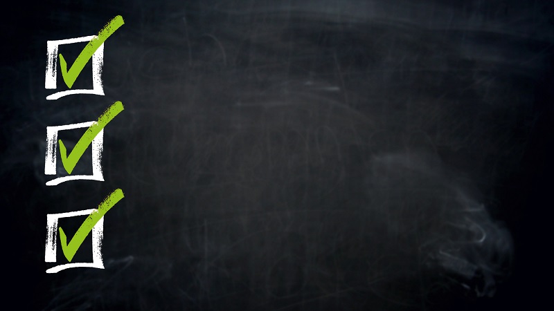 Classroom chalkboard checklist with green checkmarks