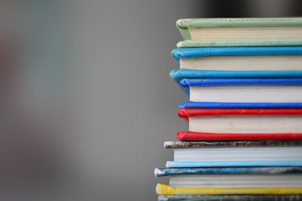 Colored Books Stacked on the right side of an image
